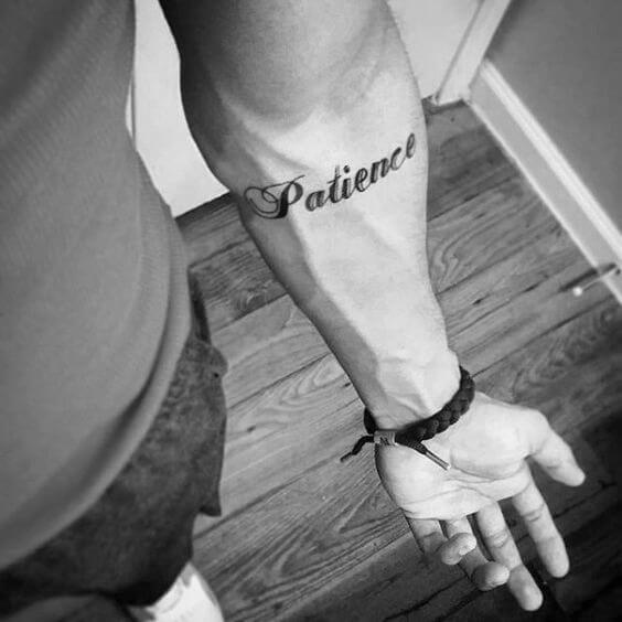 Patience lettering tattoo on the bicep